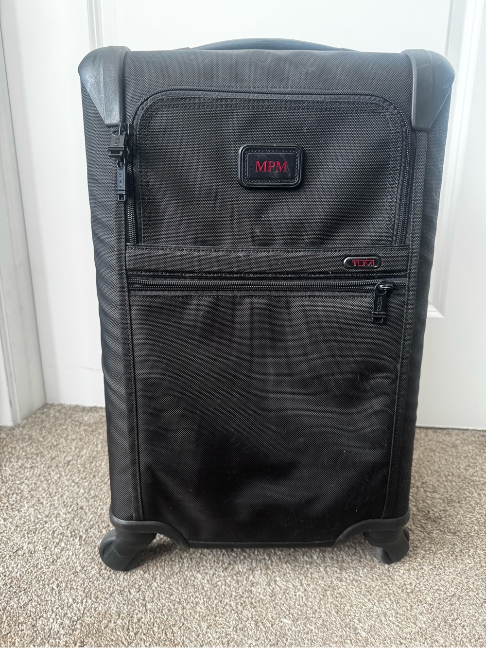 Tumi Black Softside Spinner Carry-On with Front Pockets